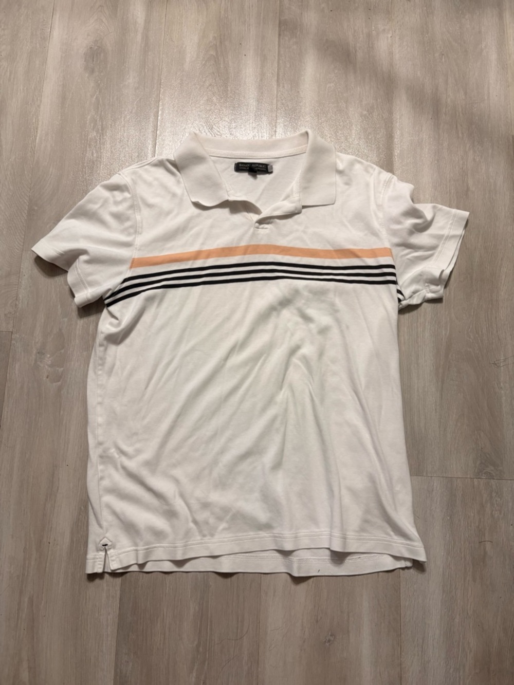 Banana Republic White Polo with Peach and Black Stripe Accents